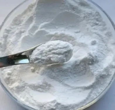 White probiotic powder in a glass dish